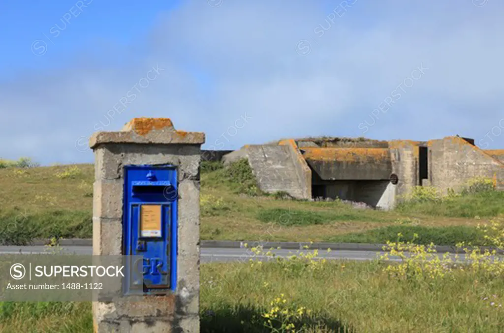 UK, Channel Islands, Guernsey, Roacquaine Bay, Old Post-box (GR - George Reigns = the then King of England) and German WW2 Slave-labour Fortifications