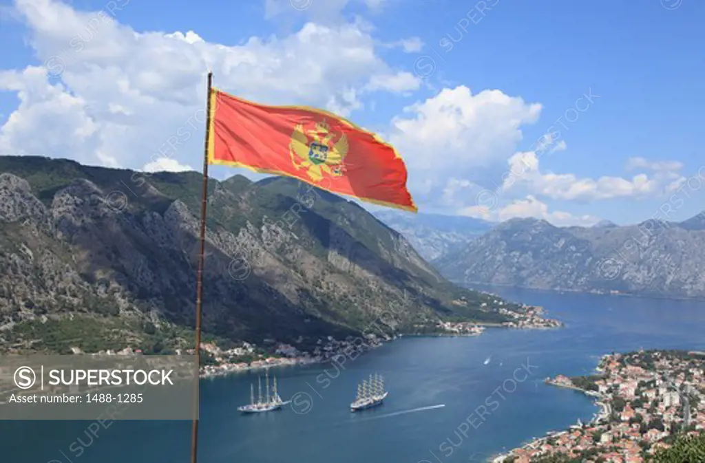Montenegro, Kotor Fjord, Montenegro Flag on St. Ivan's Fortress Overlooking Fjord
