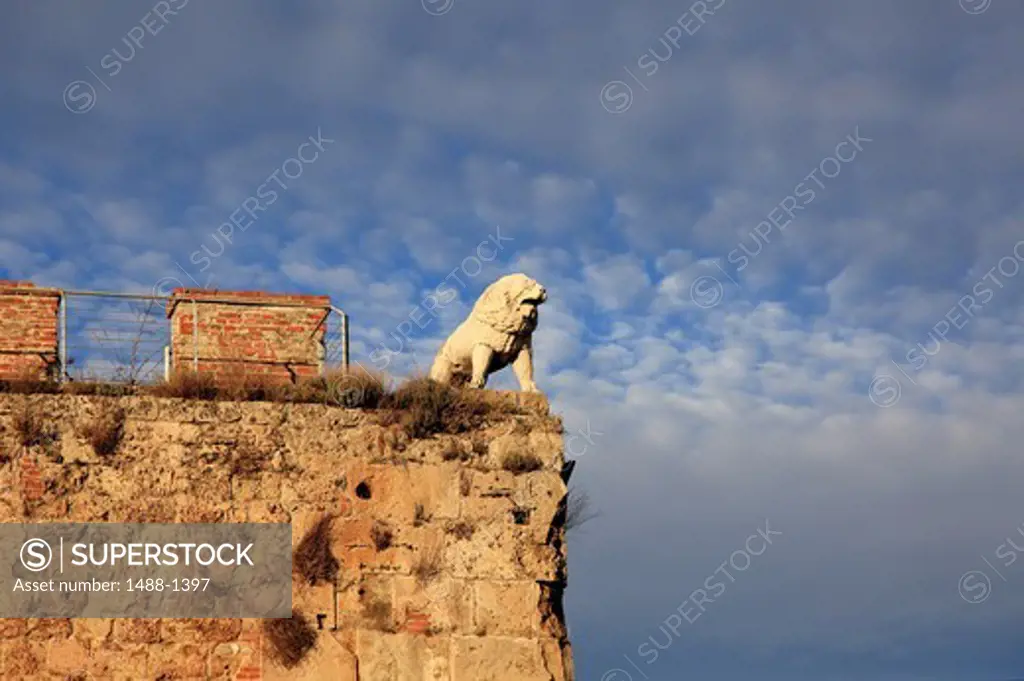 Italy, Pisa, Lion statue on external wall of Sinopie Museum