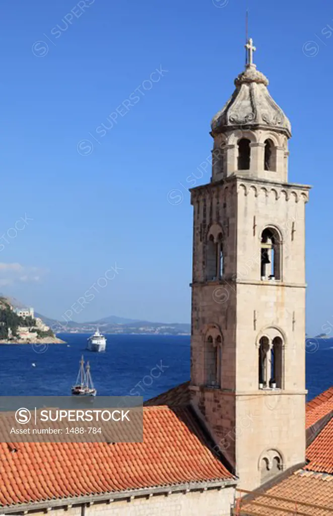 Bell tower of a church with cruise ships in the Adriatic Sea, Dubrovnik, Dalmatia, Croatia