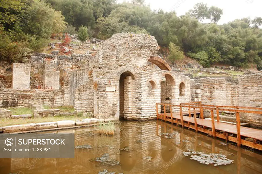 Remains of Asclepius Temple with an amphitheater in the background, Butrint, Albania