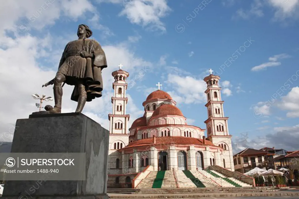 Monument in front of a church, Monument of National Fighter, Resurrection Cathedral, Korca, Albania