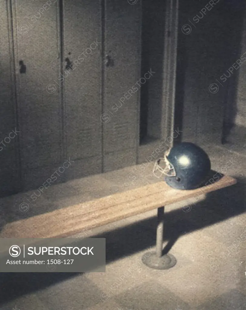 High angle view of a football helmet on a bench