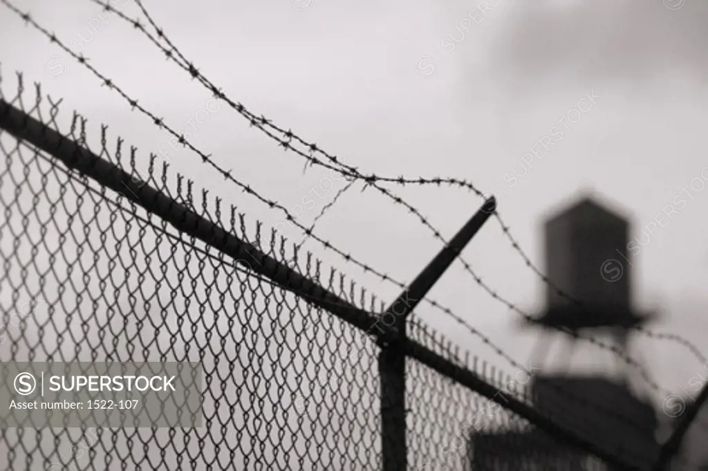 Low angle view of a chain-link fence at a prison
