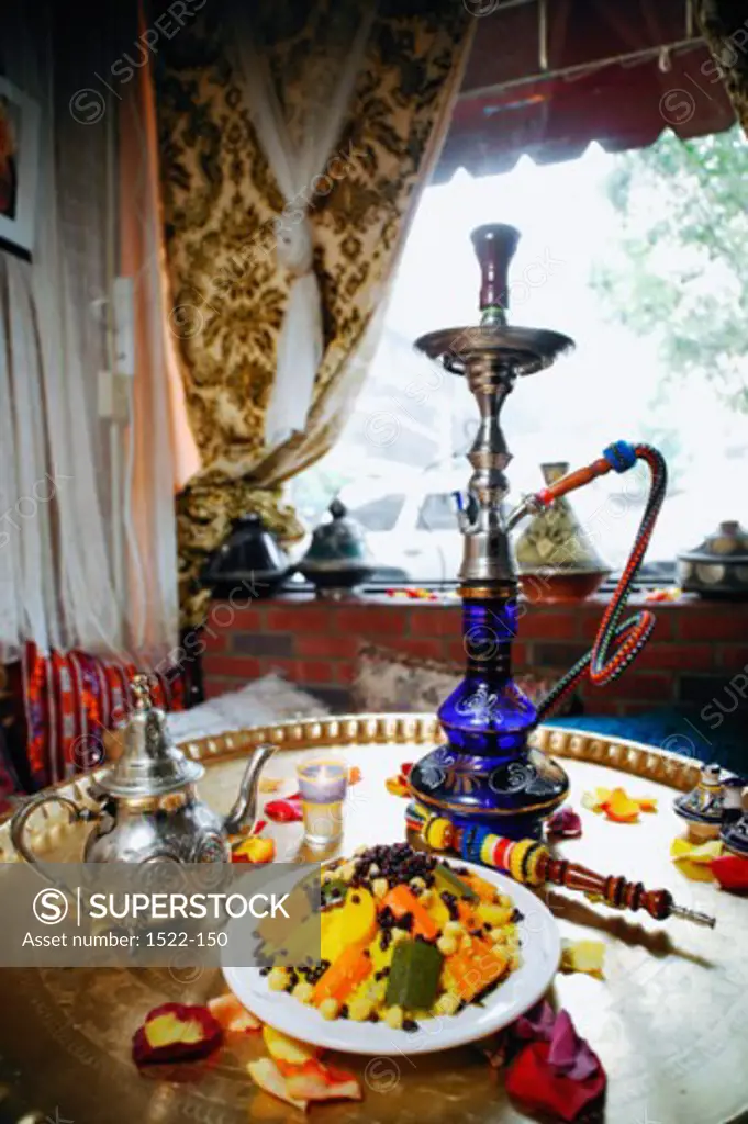 High angle view food served with a hookah on a table