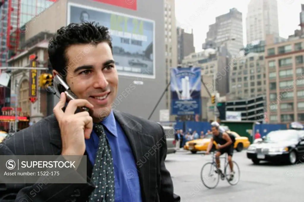 Close-up of a businessman using a mobile phone, New York City, New York, USA