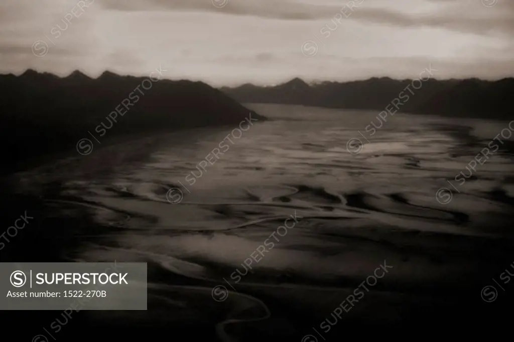 Mountain range along a riverbed, Alaska, USA