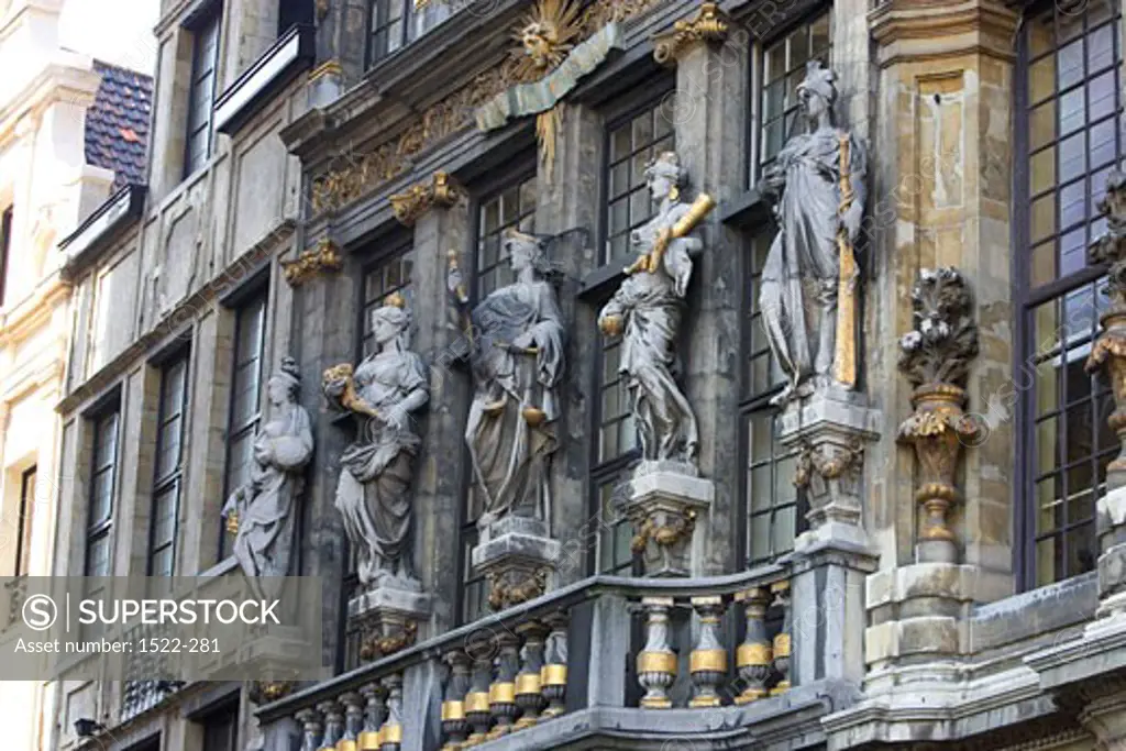 Low angle view of statues on a building, Grand Place, Brussels, Belgium