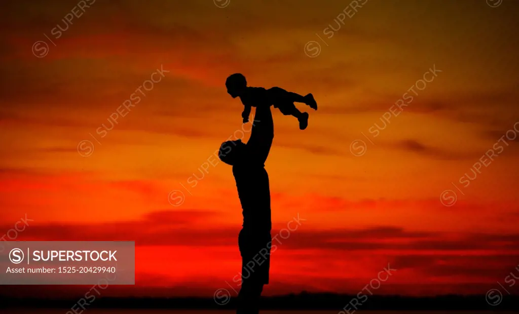 Dad tossing his lovely baby