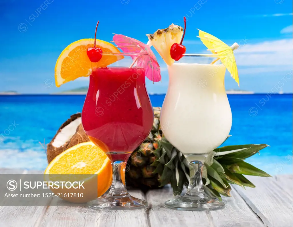 tropical cocktails with fresh fruits  on a beach