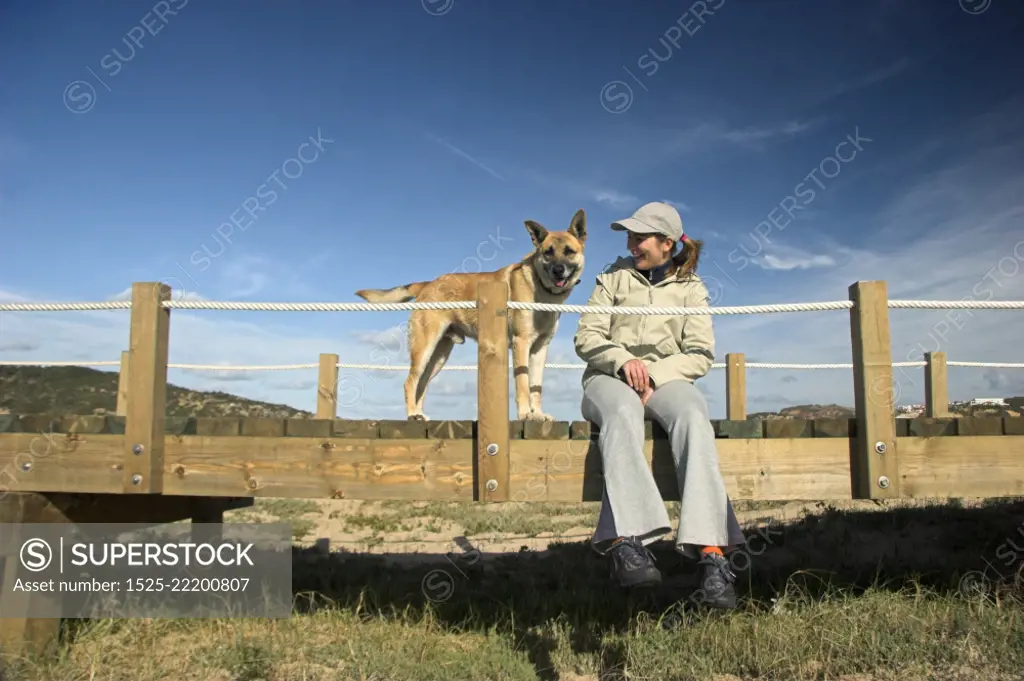 Woman sitting with her dog