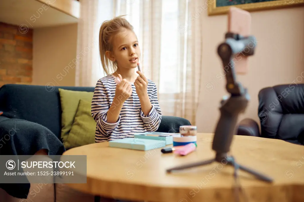 Female child records vlog, creative hobby, little vlogger. Kid blogging in home studio, social media for young audience, online internet broadcast,. Female child records vlog, little vlogger