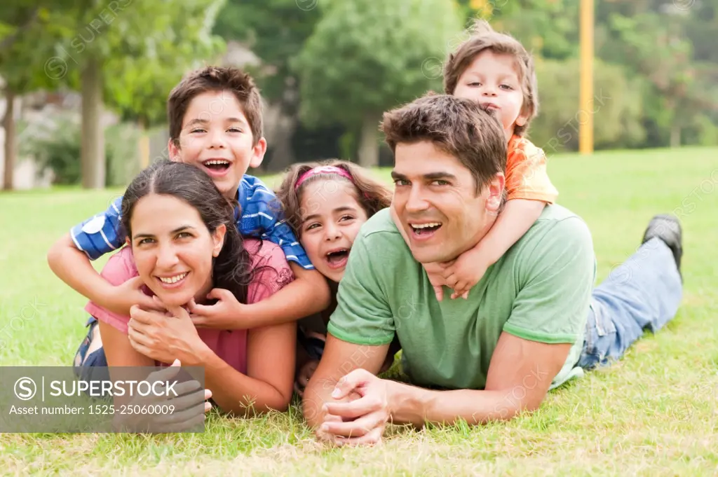 Family lifestyle portrait of a mum and dad having fun with their kids