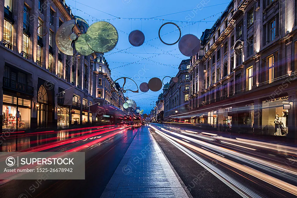 Christmas lights and traffic on Regent street at dusk, London, UK