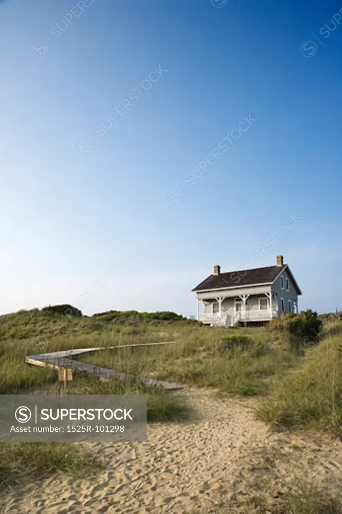 Coastal house with pathway to beach on Bald Head Island, North Carolina.