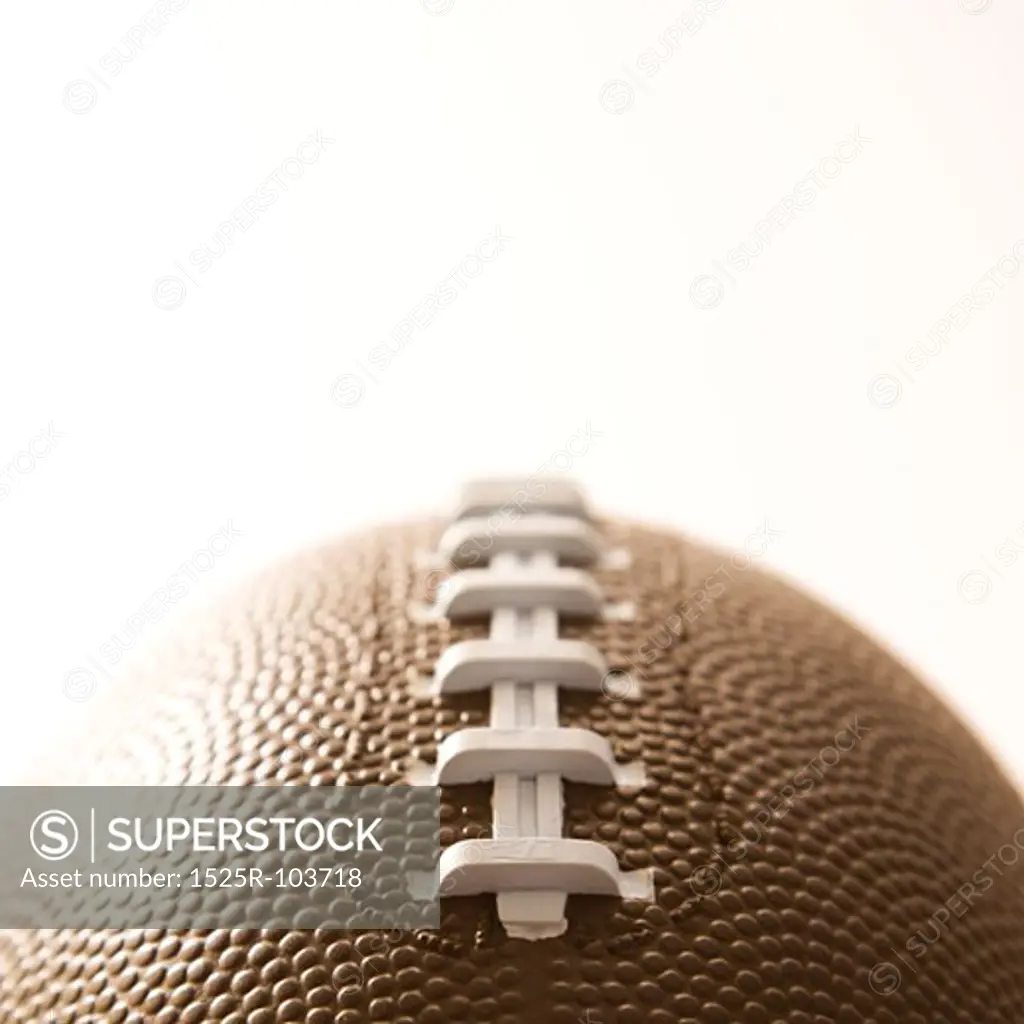 Close-up of American football on white background.
