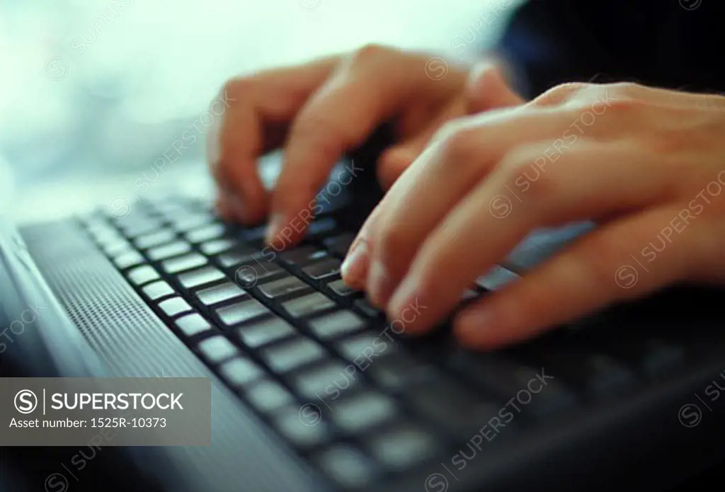 hands working on keyboard