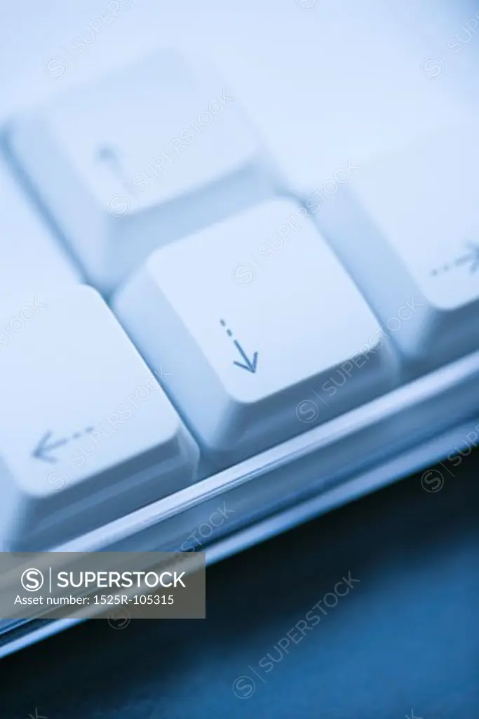 Close up of arrow keys on computer keyboard.