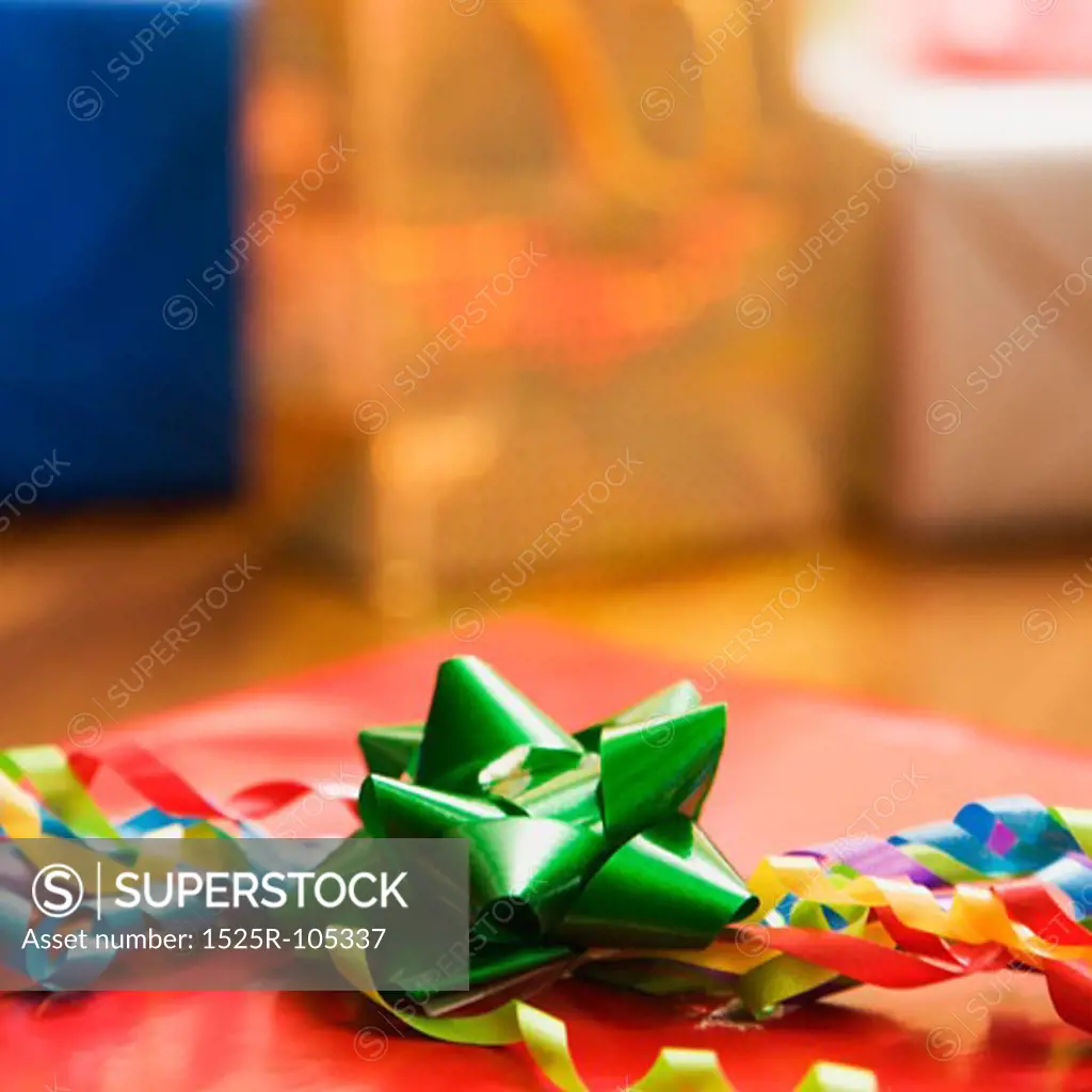 Presents wrapped and decorated with bows on a table.