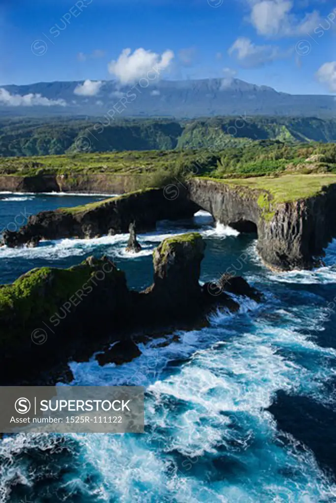 Aerial of rocky coast on Pacific ocean in Maui, Hawaii.