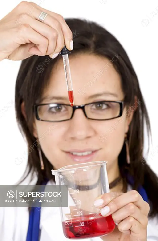 beautiful female young scientist wearing glasses while doing a blood test