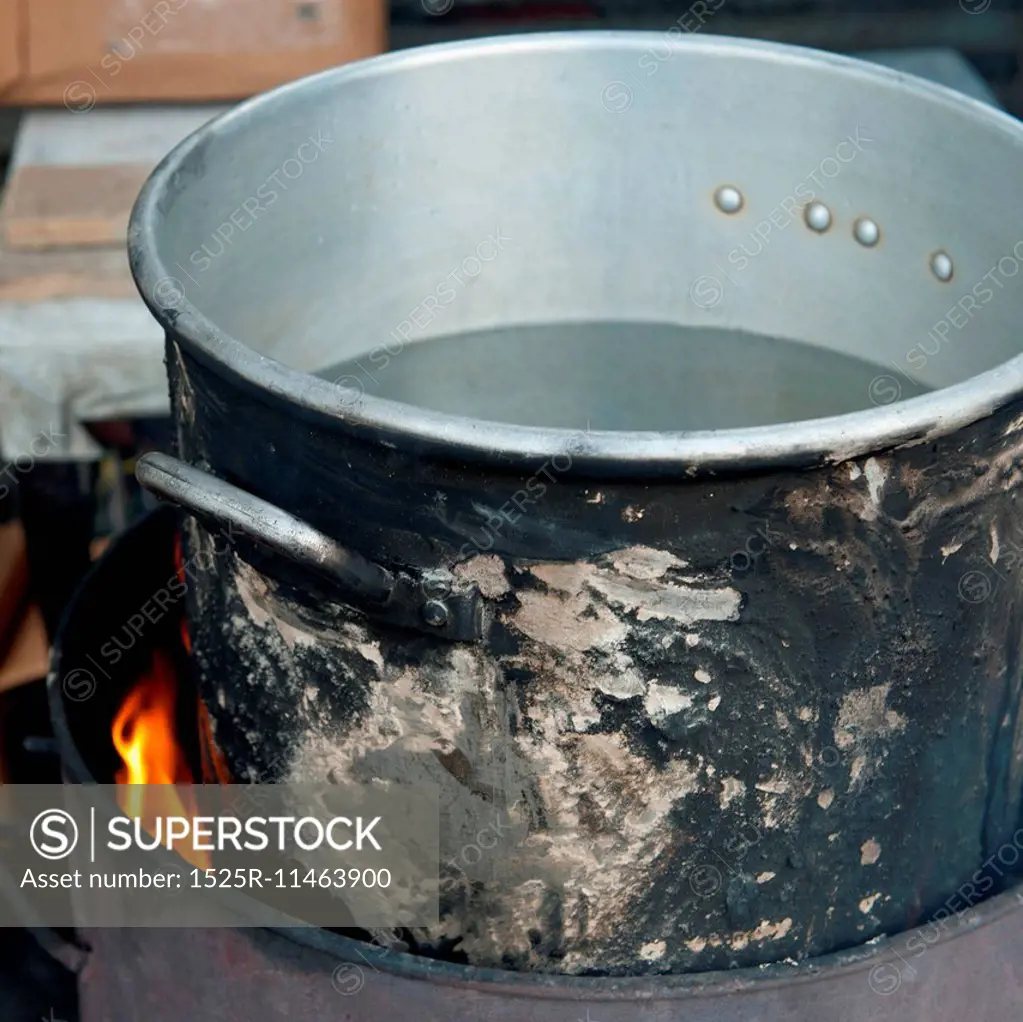 Aluminum pot on fire, Colonia Landivar, Guatemala City, Guatemala