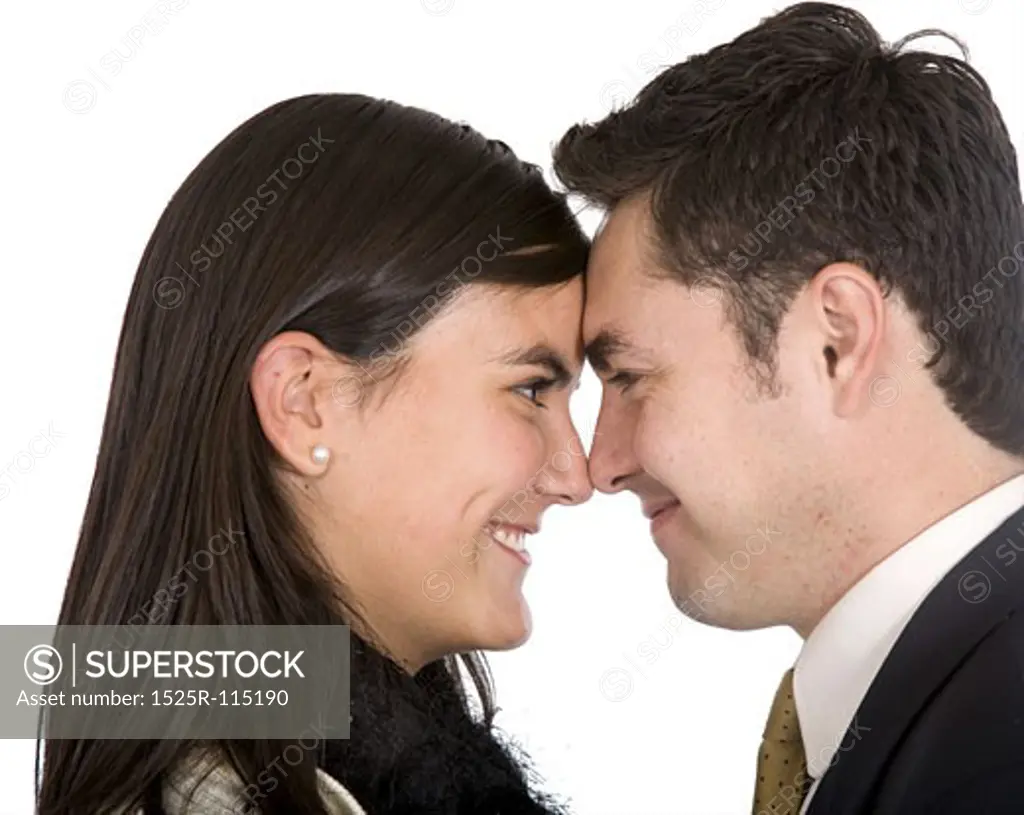 business young lovers over a white background face to face