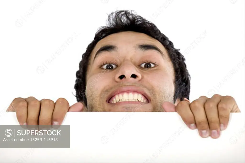 casual guy appearing over a white board isolated