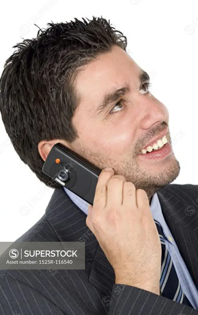 Business man on the phone smiling - isolated over a white background