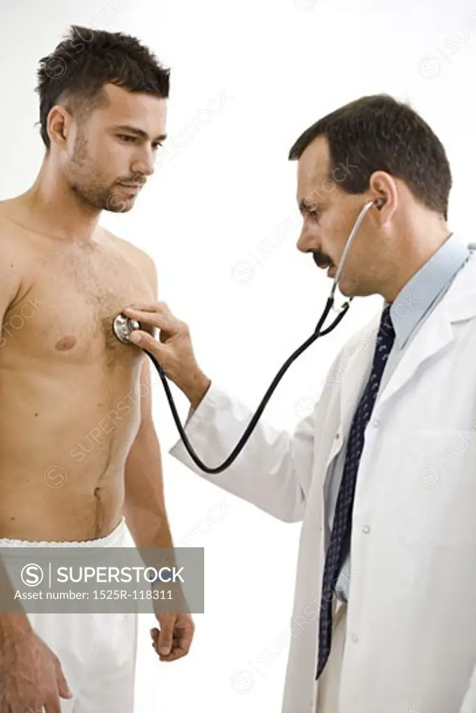 Doctor examining young male patient. 