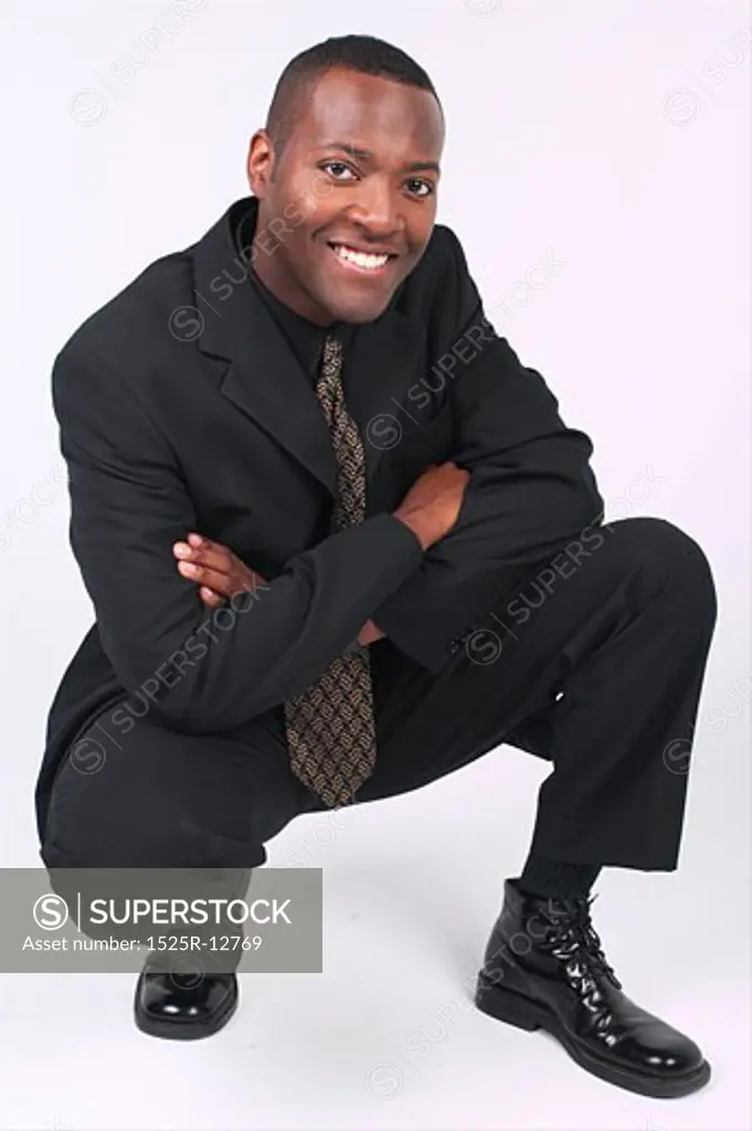 Businessman squatting a83