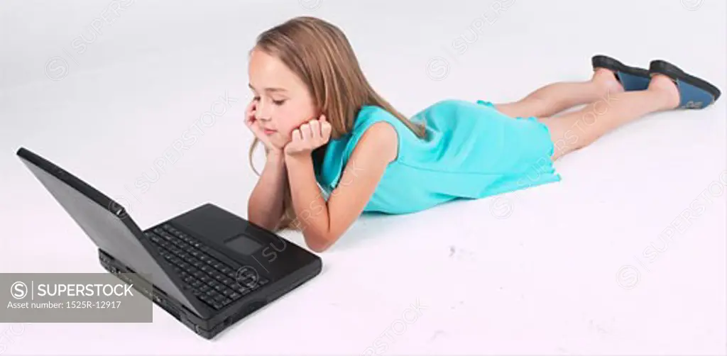 Little girl using laptop 