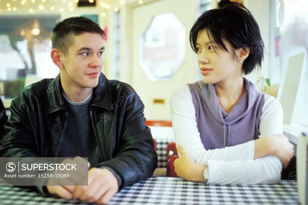 Man and Woman Talking at a Diner