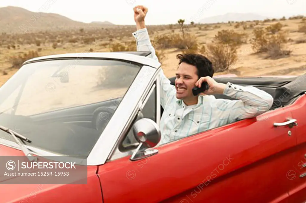 Smiling male young adult driving car 