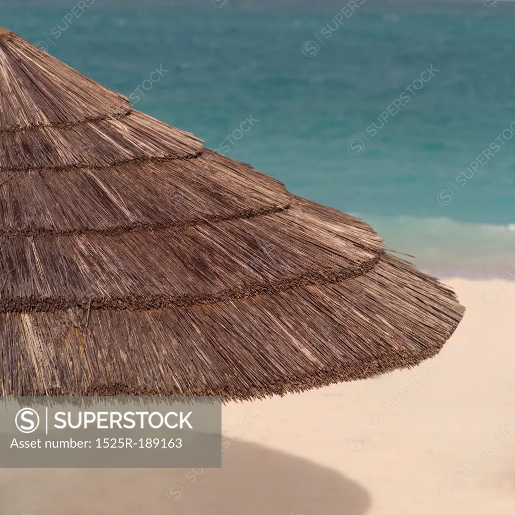 Grass umbrella on Beach at Parrot Cay