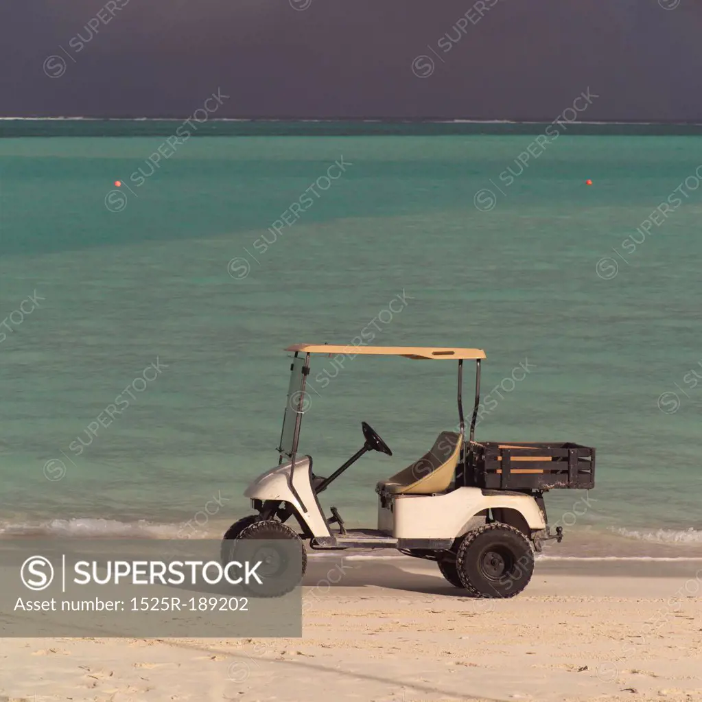 Golf cart on Parrot Cay beach