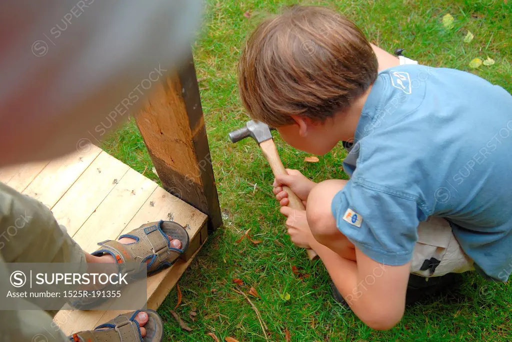 Young boys building in the garden