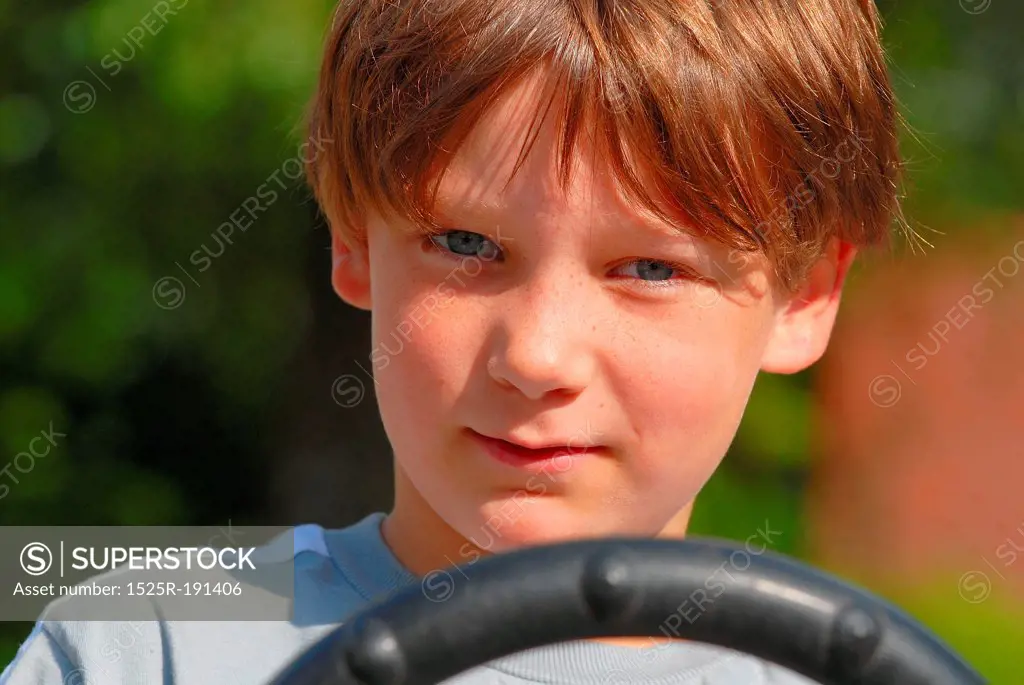Close-up of boy driving go kart