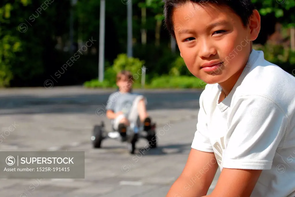 Close-up of boy driving go kart