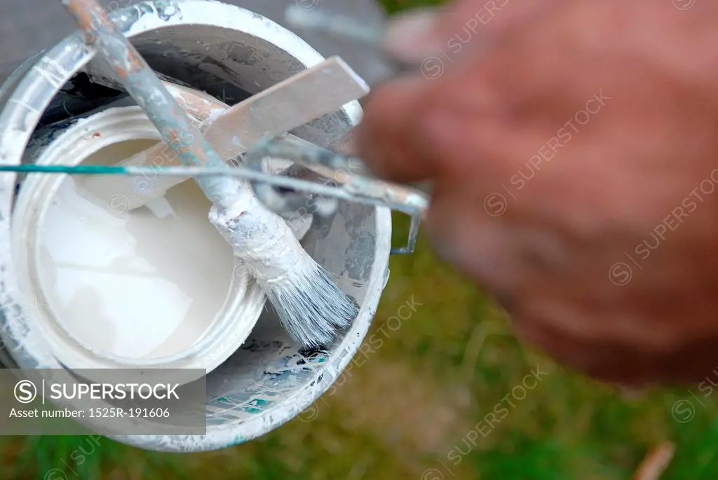 Man holding diy paint bucket