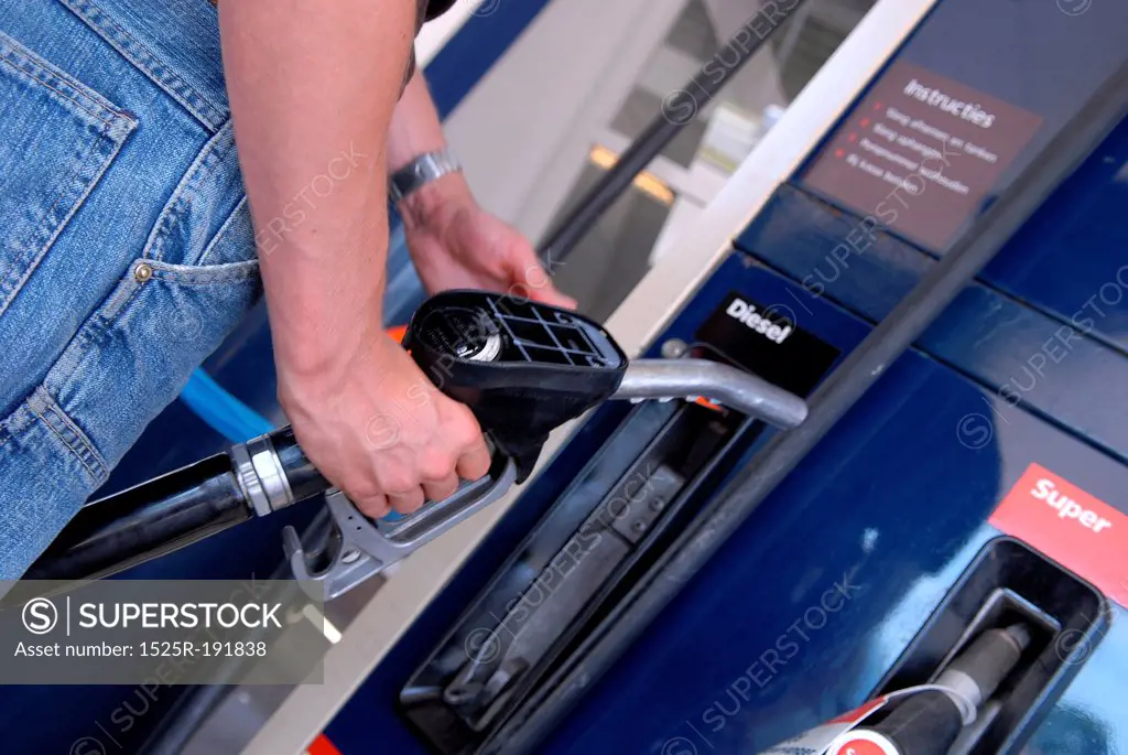 Man refuelling petrol at gas station