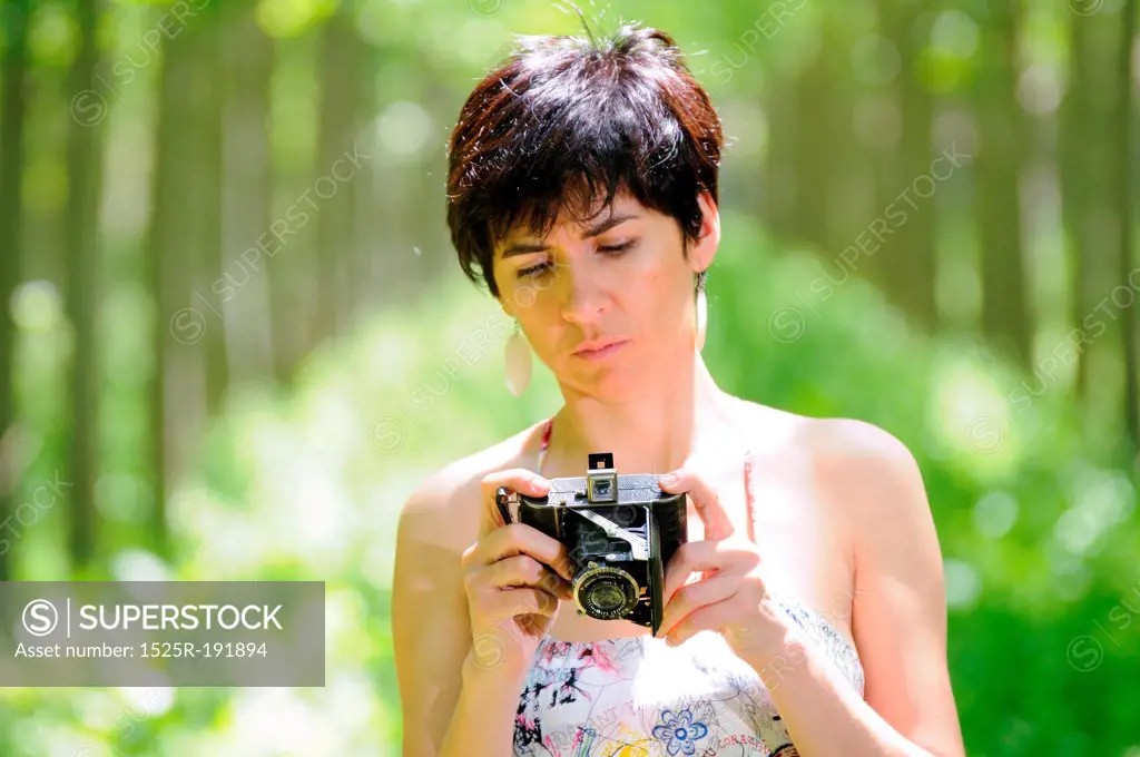 Woman holding vintage camera