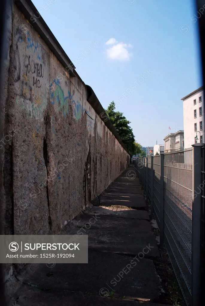 Cracked, graffiti written Berlin wall