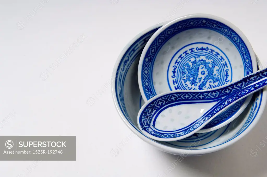 Blue asian soup bowls and spoon.