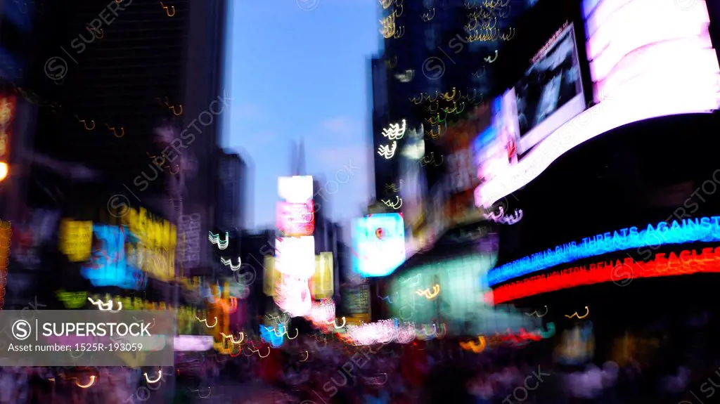Blurring lights of downtown Times Square, New York City, USA.