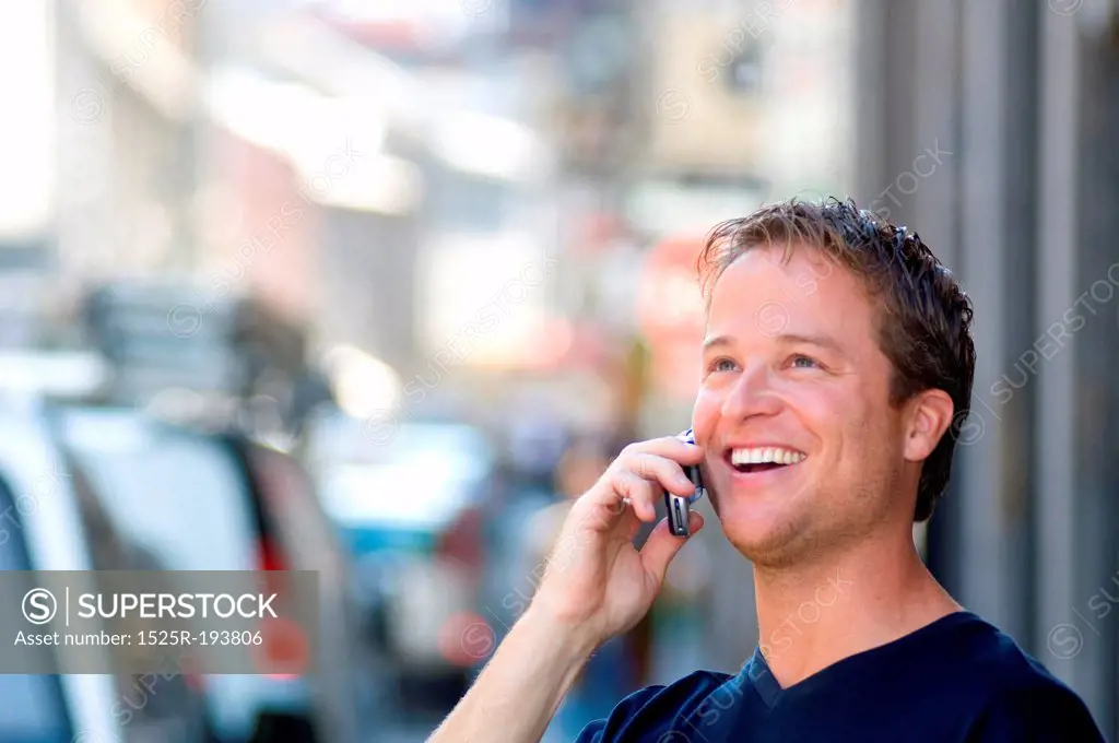 Very happy man talking his cellular phone.