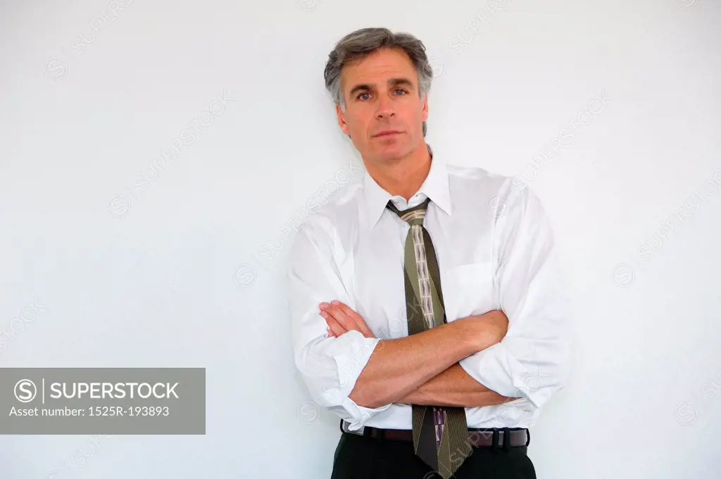 Portrait of businessman with sleeves rolled up.