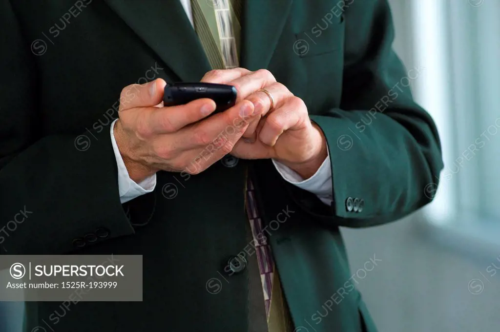 Businessman, using wireless PDA.