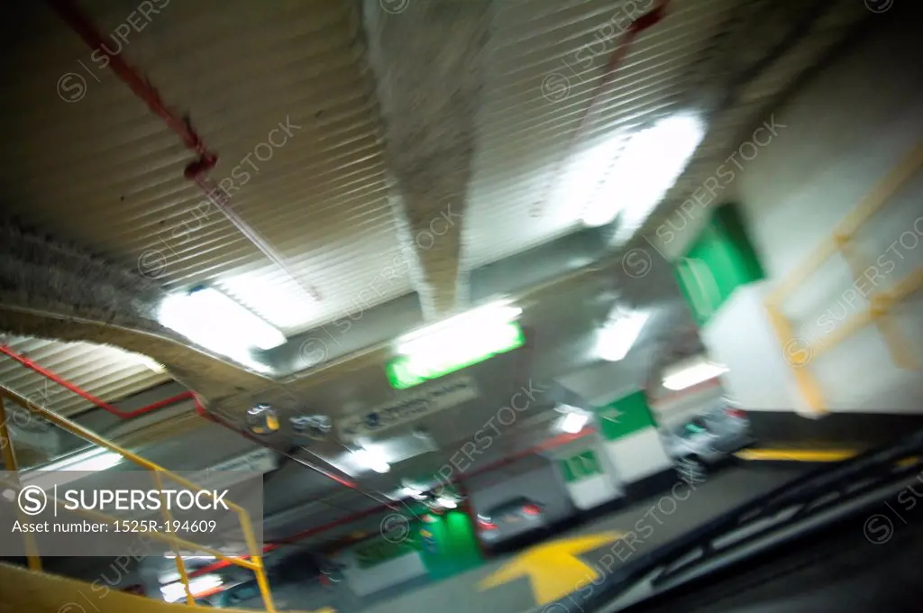 Blurred interior of under ground parking garage.