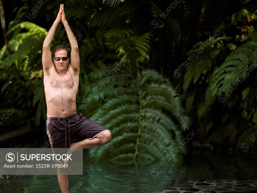 Caucasian man doing yoga in Bali